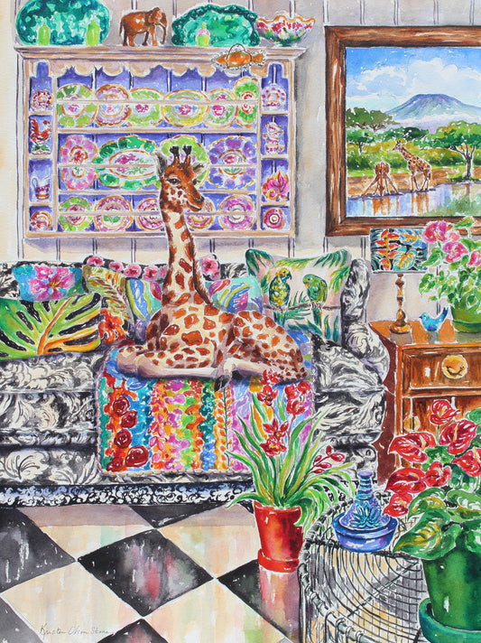 a detailed painting of a giraffe sitting on a sofa surrounded by colorful pillows.  On the wall hangs a painting of Mt Kilimanjaro in Tanzania with 2 giraffes drinking from a pond. There are potted anthuriums and orchids throughout the room.  A blue tagine sits on a wire table on the lower right corner and black and white tiles on the floor show colors reflected onto the tiles.  A lavender cabinet is filled with delicate china and a wooden elephant sculpture.