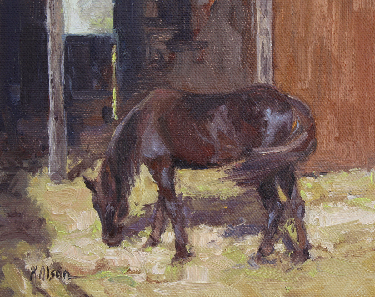 A brown or liver chestnut horse in a barn