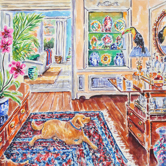 A golden labrador retriever looking up at a toucan in a tropical home interior