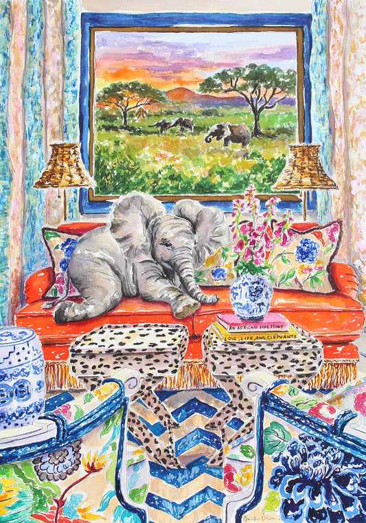 A watercolor painting of a young elephant lying on an orange sofa with a painting behind her of African elephants.  There are 2 leopard print tables and blue and white chinoiserie chairs and chevron striped rug.  Wall decor for art collectors