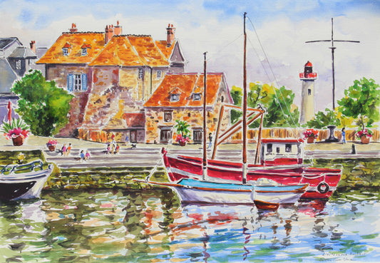 Watercolor painting of a coastal harbor scene with red and white boats moored in front of warm orange-roofed buildings, a lighthouse, trees, and reflections in the water.
