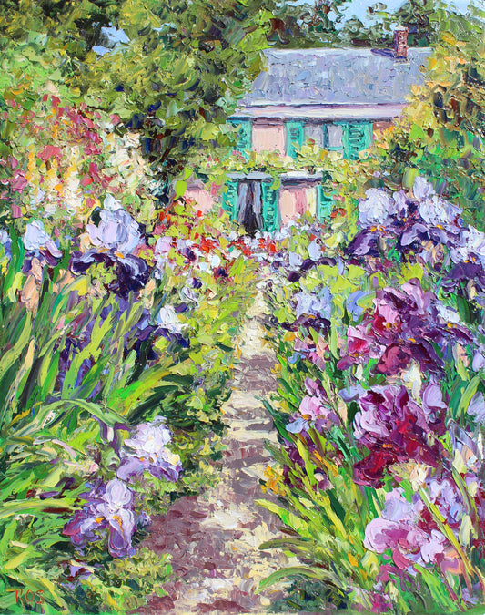 Impressionist-style painting of Monet's home and garden path leading to his house, surrounded by lush greenery and purple, pink, and lavender irises
