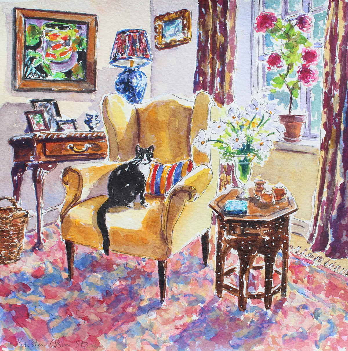 Watercolor painting of a cozy living room with a yellow armchair, a Tuxedo cat sitting on it, a striped cushion, a side table with flowers, and a colorful patterned rug. Framed wall art and a window with pink flowers are visible in the background.