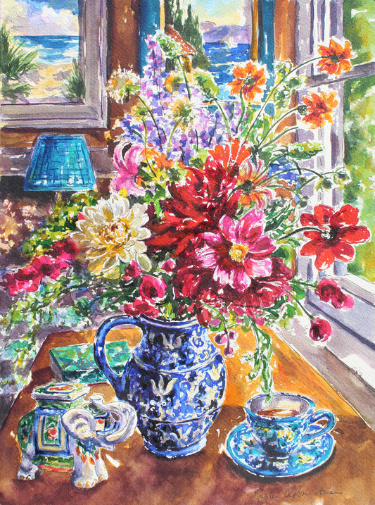 Colorful still life with flowers, a blue pitcher, and a teacup on a windowsill.