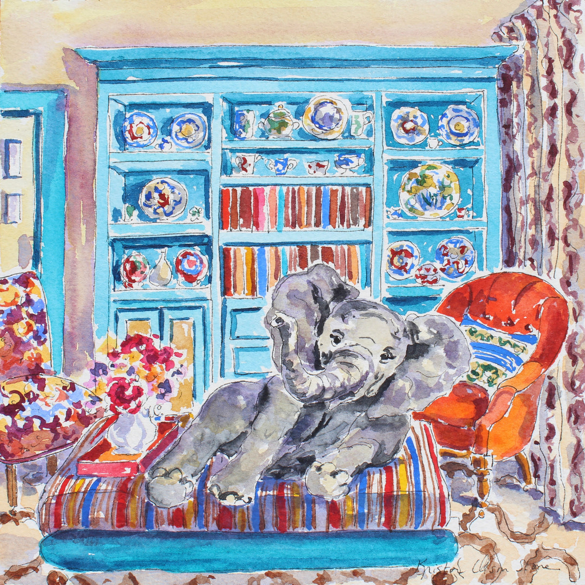 Watercolor painting of a cozy interior scene featuring a gray elephant lounging on a striped daybed in front of a large turquoise bookshelf filled with plates and books, alongside an orange armchair and floral accents.