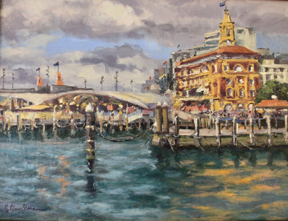 An oil painting of The Ferry Building in Auckland, New Zealand, featuring a waterfront scene with the building, its reflections in the water and a cloud-filled sky.