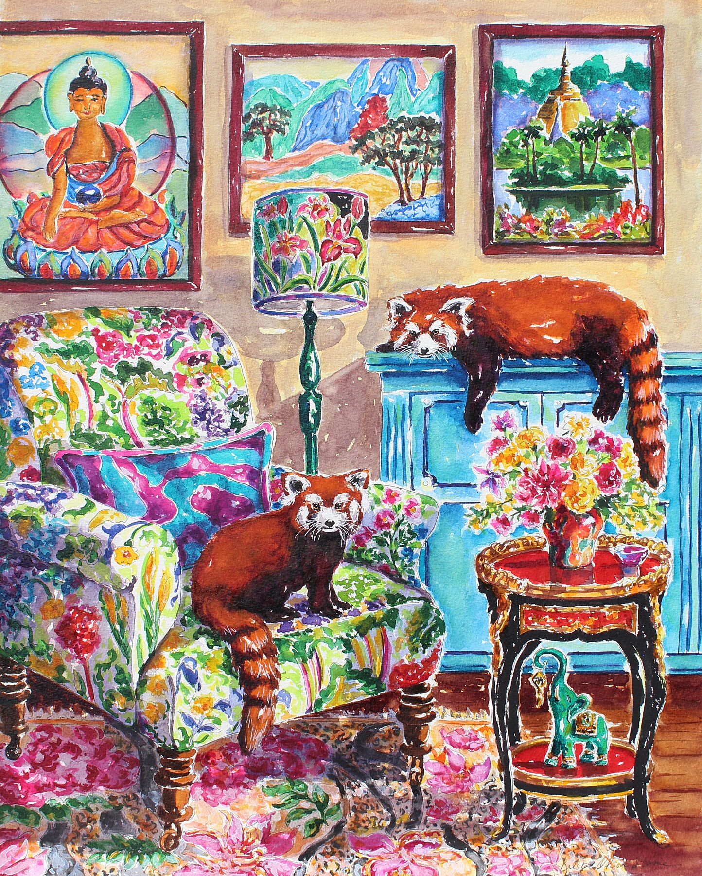 A pair of red pandas are in a cozy sitting room.  One is lying on the buffet and the other is sitting in a chair with a floral print.  A Good Luck Elephant is on the bottom shelf of an ornate asian style coffee table.  A painting of The Buddha is on the wall as well as a South East Asian temple landscape.  Wall decor for art collectors