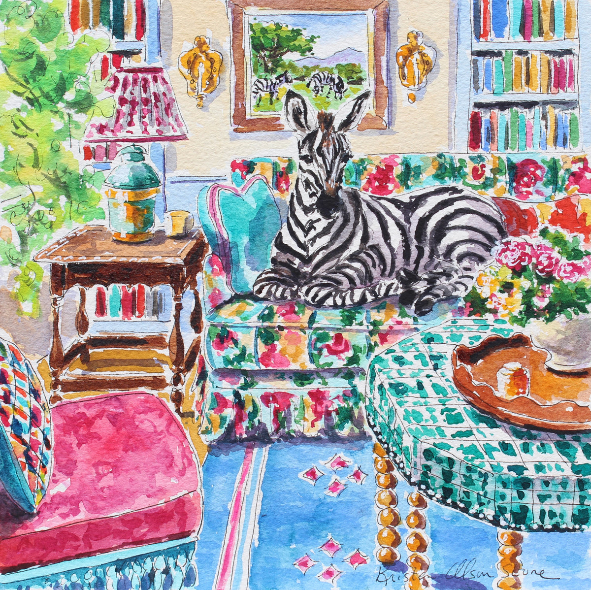 A colorful watercolor painting of a zebra lying on a floral sofa in a decorated living room with bookshelves, a lamp, and patterned textiles.